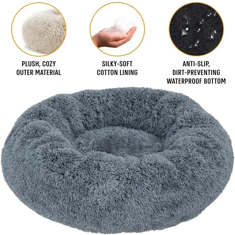 Dog curled up asleep in the Nestle round plush bed