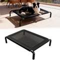 Skyline elevated dog bed with dog resting on the raised mesh cot