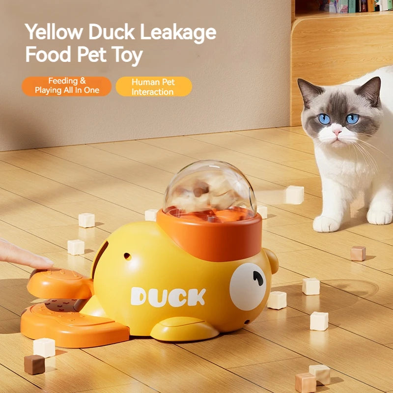 The Treat Duck on a wooden floor with a cat watching