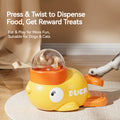 The Treat Duck dispenser with a dog pressing the orange paddle